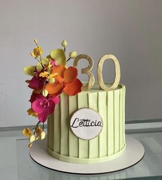 a cake with flowers and the number 30 on it