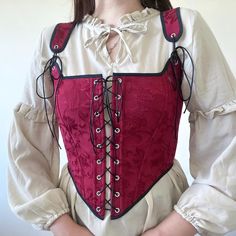 Renaissance corset burgundy made in jacquard fabric  ✔️black edging tape ✔️black satin lace adjust the height of the straps ✔️cotton lining ✔️stainless steel eyelets are located on the front and back, allowing for an adjustable  ✅SIZE Made to order The corset is sewn according to your parameters, please enter your bust, waist , full height measurements in the personalization field😊 Gothic Sleeveless Corset With Lace Trim, Gothic Overbust Corset With Lace Trim, Red Steampunk Corset Dress For Costume Party, Red Gothic Fitted Corset Belt, Red Overbust Corset Dress With Boning, Lace Trim Overbust Corset For Costume, Overbust Corset With Lace Trim For Costume, Medieval Overbust Corset For Parties, Gothic Corset Belt With Boned Bodice For Festivals