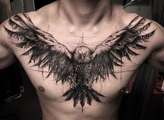 a man's chest with an eagle tattoo on his chest and wings spread out