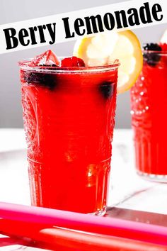 two glasses filled with berry lemonade on top of a table