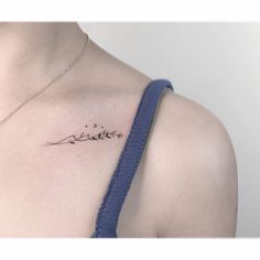 a woman with a tattoo on her chest