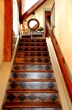 the stairs are made of wood and have black and white checkerboard pattern on them