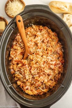 a crock pot filled with pasta and cheese