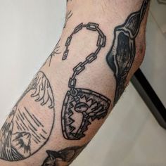 a man's arm with some tattoos on it