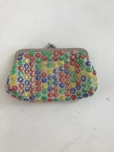 Vintage multicolored coin purse with bright colored floral beads. Metal coin purse clasp. Multicolor Beaded Pouch Coin Purse, Handmade Vintage Multicolor Coin Purse, Multicolor Beaded Coin Purse Pouch, Multicolor Beaded Rectangular Coin Purse, Handmade Multicolor Clutch Coin Purse, Multicolor Wallet As Spring Gift, Multicolor Wallet For Spring Gift, Multicolor Beaded Clutch, Everyday Multicolor Beaded Coin Purse