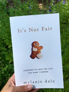 someone is holding up a book with a ginger on it's cover and the title, it's not fair learning to love the life you didn't choose