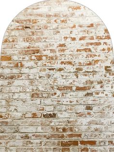 an old brick wall with a circular mirror