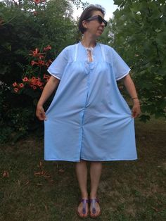 "Vintage 80s blue night gown. Short sleeve nighty decorated with lace details. Front buttoned nighty. L size. From shoulder to shoulder 15,5\"39,5cm Bust 46\"117cm Sleeve length 9\"23cm Length 40\"102cm." Blue Short Sleeve Nightgown For Sleep, Blue Short Sleeve Nightgown For Bedtime, Blue Short Sleeve Dress For Night, Light Blue Lace Trim Nightgown For Summer, Vintage Short Sleeve Sleepwear With Lace Trim, Blue Short Sleeve Nightgown For Summer, Short Sleeve Lace Trim Sleepwear For Home, Blue Short Sleeve Sleepwear For Night, Light Blue Lace Trim Nightgown For Home