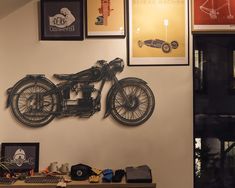 a motorcycle is mounted on the wall above a desk