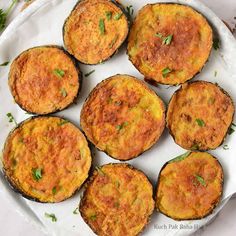 baked potato cakes on a plate with parsley