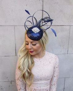 ** If you need your item by a certain date please let me know. **Beautiful vintage style fascinator hatFeaturing navy blue feathers and detailing with silver diamantes on a navy blue sequinned base.Mounted securely on concealed silver tone metal hair clips. We can do this on hat elastic instead of clips on request.Brand new. The base measures 13cm in diameter.Made in the UK. Custom orders are welcome!Many more items like this are available in our shop! Blue Feathered Headpiece For Party, Elegant Blue Headpiece With Feather Trim, Blue Feathered Mini Hat For Evening, Blue Mini Hats With Feathers For Evening, Elegant Blue Costume Hats And Headpieces With Feather Trim, Blue Party Hat With Feather Trim, Blue Party Hats With Feather Trim, Elegant Blue Costume Hat With Feather Trim, Blue Party Costume Hat With Feather Trim