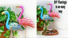 two flamingos are standing next to each other in front of a potted plant