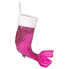 a pink and white christmas stocking hanging from a string