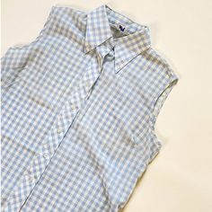 "70s Sears shirt in baby blue gingham print featuring collared neckline, curved hem, and button down closure. Era: 70s Notes: Good condition Material: n/a By: Sears Size: M-L Measurements taken flat across Pit to pit: 20\" Length: 25\" All items are vintage + may show natural, minor signs of wear." Gingham Button-up Tops For Daywear, Spring Gingham Shirt With Spread Collar, Vintage Gingham Button-up Shirt, Preppy Gingham Collared Tops, Summer Shirt With Peter Pan Collar, Retro Spring Shirt With Placket, Collared Gingham Top With Buttons, Retro Plaid Shirt For Spring, Retro Gingham Tops With Button Closure