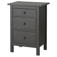 a gray wooden nightstand with three drawers