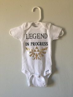 Hey, I found this really awesome Etsy listing at https://www.etsy.com/listing/601333279/legend-of-zelda-onesie Legend Of Zelda Gender Reveal, Zelda Gender Reveal, Zelda Baby Shower Ideas, Legend Of Zelda Nursery, Nerdy Gender Reveal, Zelda Nursery, Zelda Merch, Zelda Baby, Zelda Gifts