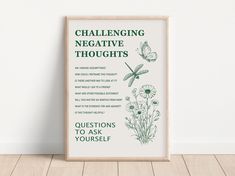 a framed poster with the words challenging negative thought and dragonflys on it in front of a white wall