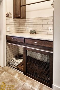 a kitchen with a stove and cabinets in it