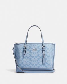 Signature chambray and smooth leather Zip-top closure, fabric lining Side open compartments Handles with 4 3/4" drop Detachable strap with 22" drop for shoulder or crossbody wear 9 3/4" (L) x 7 1/2" (H) x 4 3/4" (W) Dressy Hats, Handbag Heaven, Luxury Purses, Girly Shoes, Coach Outlet, Essential Bag, Cute Bags, Wallet Bag, Bags Designer Fashion