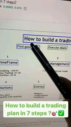 a hand is holding a pen and pointing at a screen with the words how to build a trading plan in 7 steps?