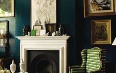 a living room filled with furniture and pictures on the wall above a fire place in front of a fireplace