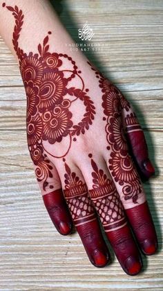 henna tattoo on the palm of someone's hand