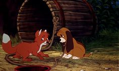 the fox and the hound are in front of a barrel