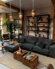 a living room filled with lots of furniture and plants in it's centerpieces