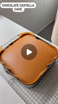 a chocolate cake sitting on top of a cooling rack