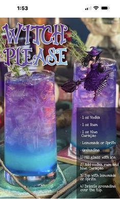 two purple and blue cocktails sitting on top of a table next to each other