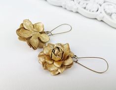 Gold Leather Rose Flower Earrings -Material - genuine leatherColor - soft goldSizes - flower diameter -3.5 cm or 1.4", hooks lenght is 3 cm or 1.2''Standard International Delivery from Latvia (Europe) via Latvijas Pasts to the U.S. usually takes about 10 - 20 business days.Thanks for looking! Gold Flower Earrings With Handmade Details, Adjustable Gold Flower Earrings, Gold Flower Earrings With Handmade Details For Party, Handmade Flower Gold Earrings For Gift, Adjustable Gold Jewelry With Handmade Flowers, Gold Flower Earrings With Lever Back, Gold Flower Earrings With Handmade Flowers, Gold Earrings With Handmade Flowers As Gift, Gold Earrings With Handmade Flowers For Gift