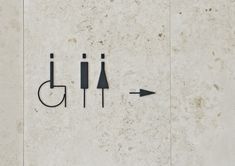 an image of a bathroom sign with arrows pointing to the toilet and urinals