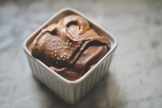 a small container filled with ice cream on top of a table