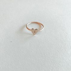 Make a sentimental statement with this custom ring. The heart pendant is so pretty and is a romantic addition to your ring stack. Choose up to three characters to show your love with our Heart Keepsake Ring. Materials: 14k Gold Fill, 14k Rose Gold Fill, Sterling Silver Measurements: .25” Heart Charm Adjustable 14k Gold Valentine's Day Jewelry, Rose Gold Heart Charm Ring As Gift, Elegant Stackable Rings With Heart Charm For Gift, Minimalist 14k Gold Jewelry For Valentine's Day, Adjustable 14k Gold Jewelry For Valentine's Day, Heart-shaped Promise Ring, Rose Gold Rings With Heart Charm As Gift, 14k Rose Gold Fine Jewelry For Valentine's Day, Personalized Heart-shaped Promise Ring