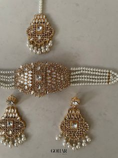 Eshaal Choker Set: Beautifully designed with intricate mirror work and faux pearls. Our Eshaal set consists of a choker, earrings and matching tikka. Bollywood Style Pearl Sets With Stone Work, Pearl Chandbali Sets With Stone Work, Festive Elegant Choker With Mirror Work, Festive Party Choker With Mirror Work, Festive Wedding Choker With Mirror Work, Intricate Mirror, Choker Set, Mirror Work, Beautiful Earrings