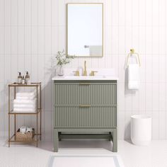 a bathroom with a sink, mirror and towel rack on the wall next to it