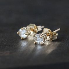 Stunning rose cut diamonds shine from modern prong settings in these gorgeous earrings. This is solid 14k gold, recycled and refined in the U.S. The diamonds are .15 carats each (3.5mm), 1/3 carat total weight, SI1, G-H color, and 100% conflict-free. The studs come with 14k gold tension backs, as pictured. You can choose from 14k yellow or 14k rose gold. A rose-cut diamond has a flat base and a crown made up of triangular facets that are symmetrically arranged and rise to form a point at the top 14k Gold Single Cut Diamond White Earrings, 14k Gold Rose Cut Diamond Earrings For Gift, Yellow Gold Rose Cut Diamond Anniversary Earrings, Yellow Gold Diamond Earrings With Rose Cut For Anniversary, Yellow Gold Rose Cut Diamond Earrings For Anniversary, Anniversary Rose Cut Diamond Earrings In Rose Gold, Gift Rose Cut Diamond Earrings, Anniversary Rose Gold Rose Cut Diamond Earrings, Diamond White Rose Cut Diamond Earrings As Gift