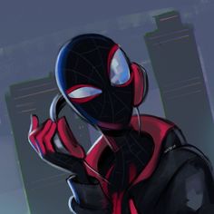 a spider - man is standing in front of a tall building and holding his hand to his face