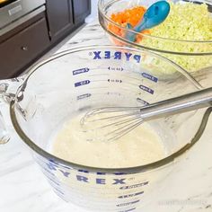 two bowls filled with different types of food on top of a counter next to an oven