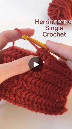 someone is crocheting the side of a red bag