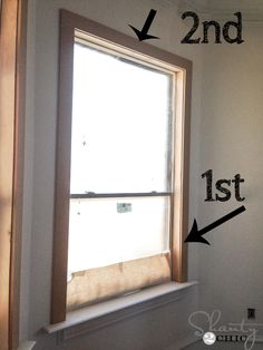 an empty window with the words 2nd, 1st and 3rd written in black on it