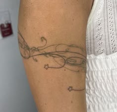 a woman with a tattoo on her arm