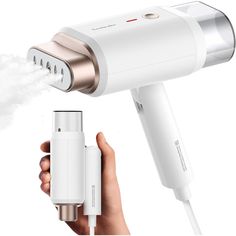 an electric hair dryer is being used to dry someone's hair with it