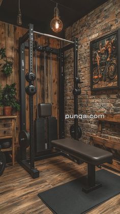 a home gym with a bench, squat machine and barbells in front of a brick wall