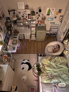 an overhead view of a bedroom with a bed, desk, and other items on the floor