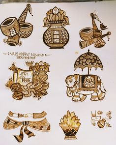 various designs on a piece of paper with writing in the middle and below it, including an elephant