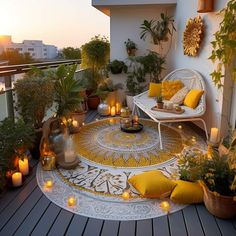 an outdoor patio with candles and potted plants