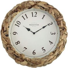 a white clock with black numbers on it's face in a woven rope frame