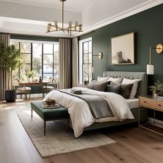 a bedroom with green walls and white bedding, wooden floors, large windows, potted plants on either side of the bed