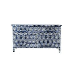 a blue and white chest with an intricate design